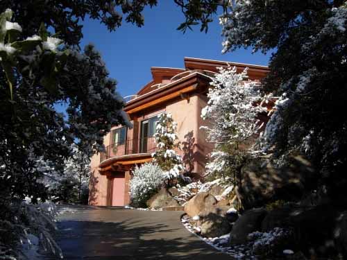 Winter view of the east side of a Poured Earth home in Prescott, AZ
